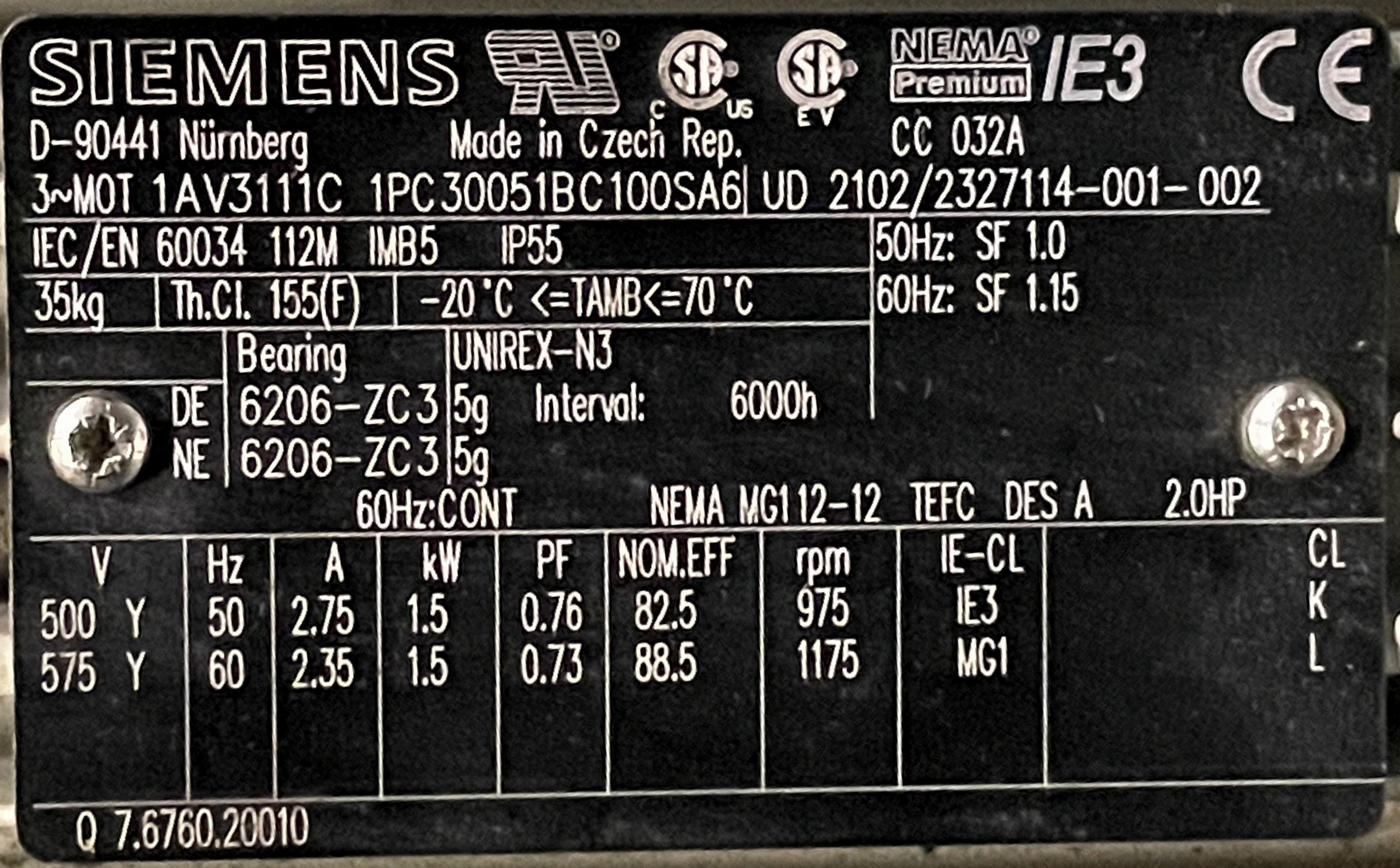 Close-up of a Siemens nameplate on an electric motor, showing technical specifications including model number, power, voltage, frequency, and efficiency ratings.