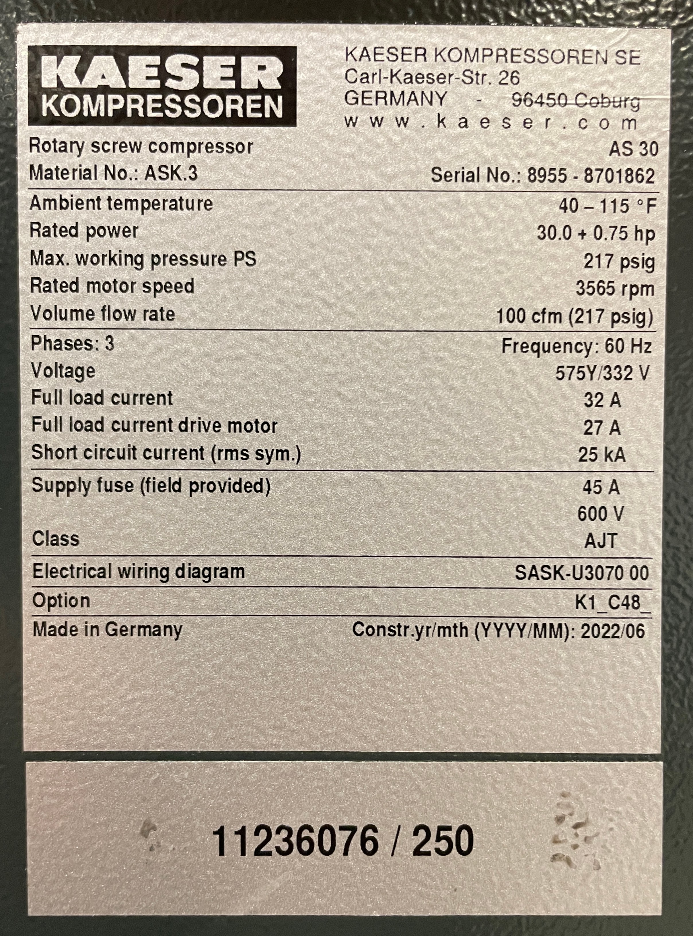 Close-up of a label on a Kaeser compressor listing specifications, including model AS 30, power 30.0 (HP), voltage 575/332V, and manufacturing date 06/2022. The serial number is 8955-8701862.