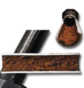 Cutaway showing contaminant buildup in black iron pipe.
